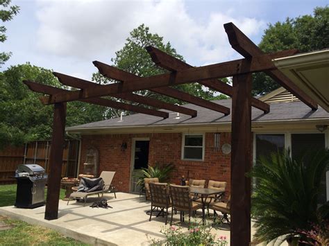 sloped pergola attached to house